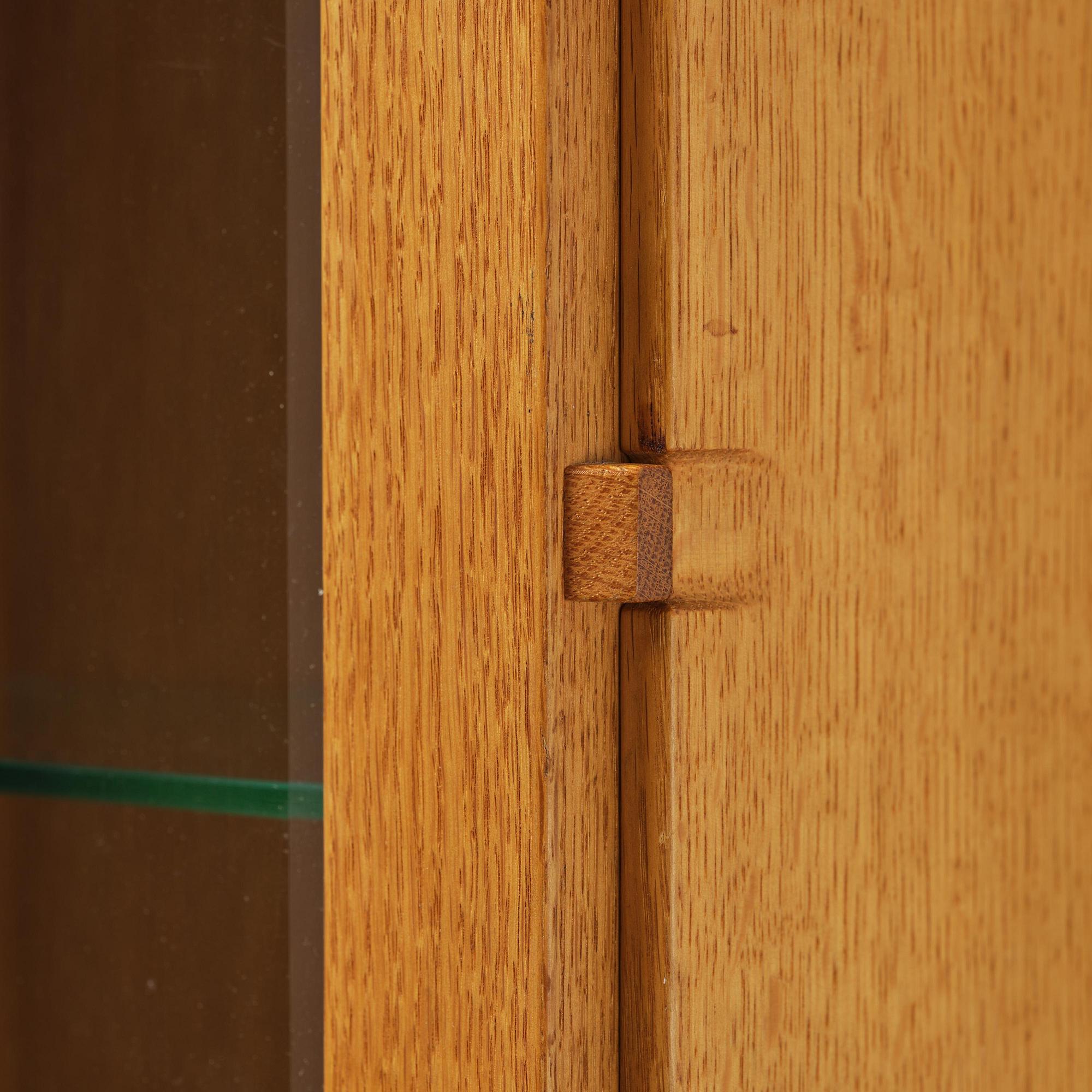 James Krenov, an oak or doussie showcase wall cabinet, executed in his own workshop, Bromma, Sweden.