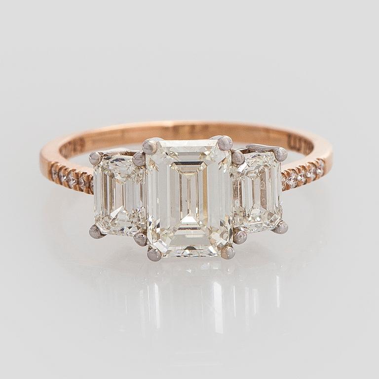 Ring, three baguette cut diamonds, small brilliant cut diamonds, 18K white gold and rose gold.