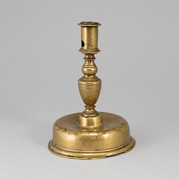 A 17th century bronze candlestick.