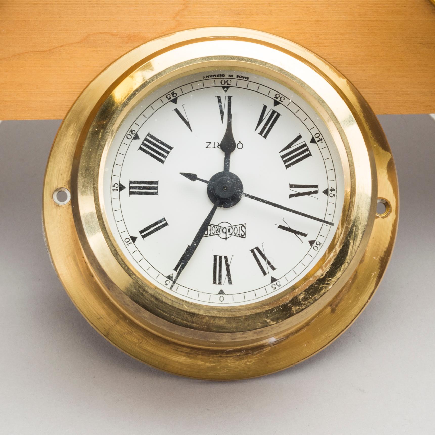 TWO BRASS MARINE CLOCK AND A BAROMETER BY STOCKBURGER.