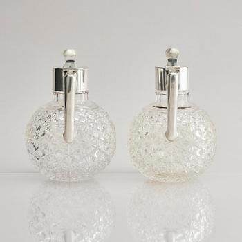 A Swedish pair of silver and cut-glass decanters, mark of C.G. Hallberg, Stockholm 1893.
