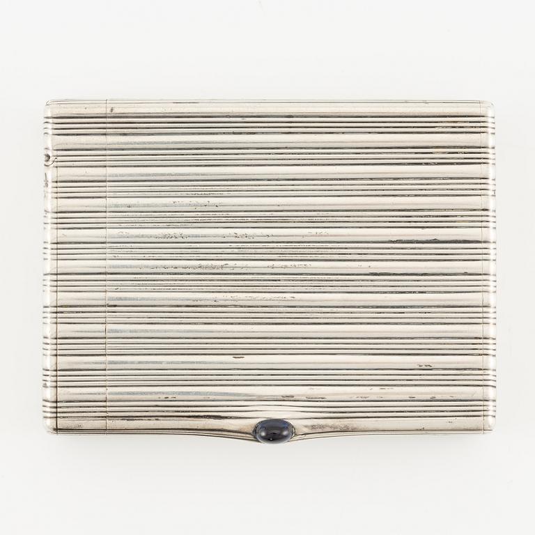 A Silver-gilt Fabergé Cigarette and Match Case, workmaster August Frederik Hollming, St. Petersburg 1908-1917.