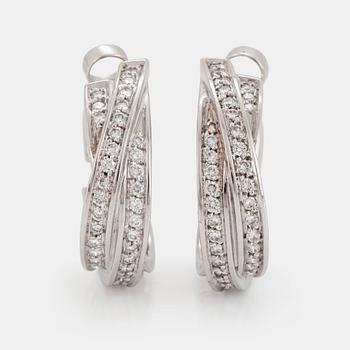 1069. A pair of Cartier "Trinity" earrings in 18K white gold set with round brilliant-cut diamonds.