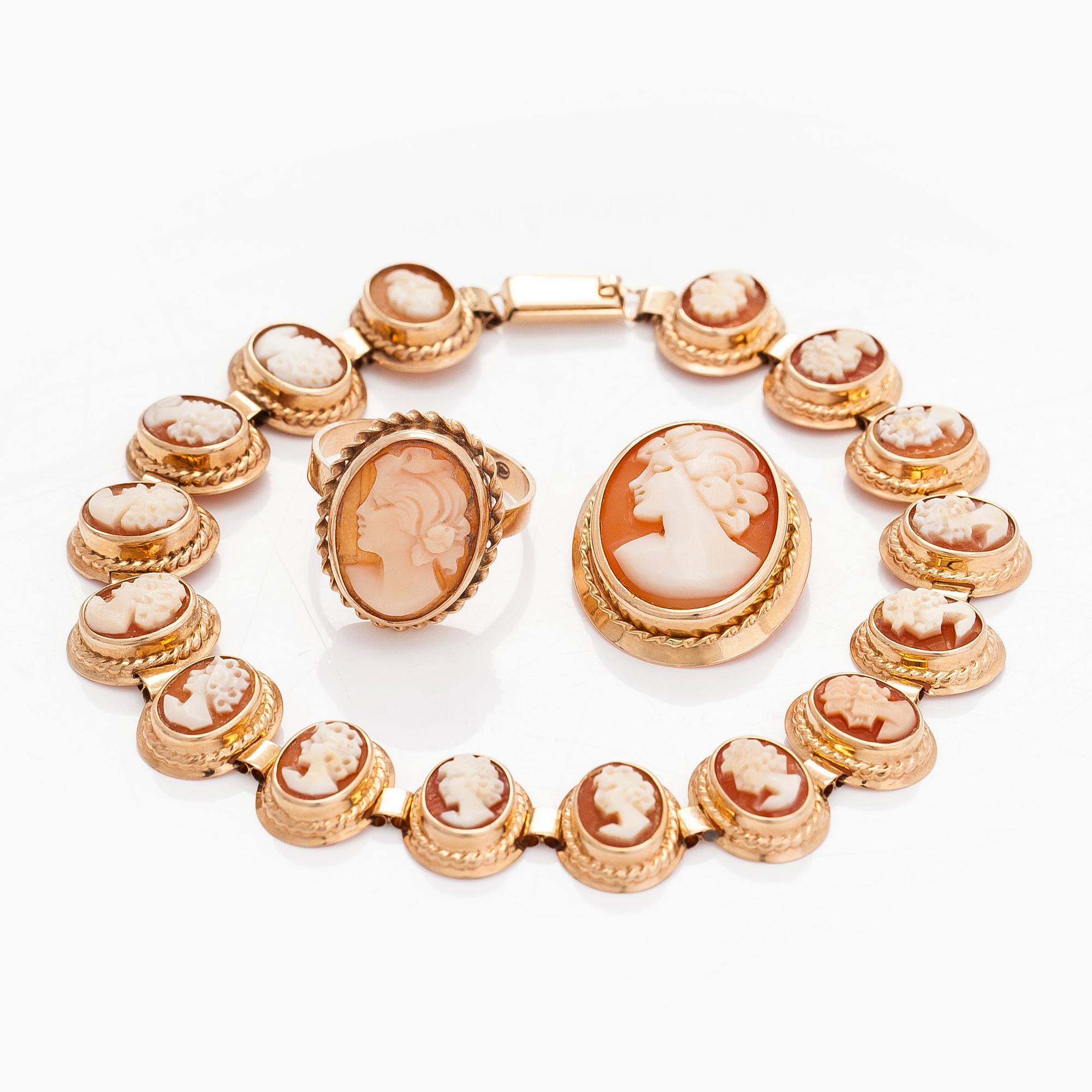 A 14K gold and shell cameo jewelry set, bracelet, pendant/brooch and ring.