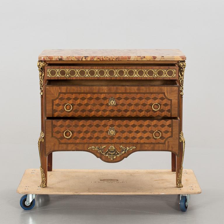 A Louis XVI-style bureau around 1900.