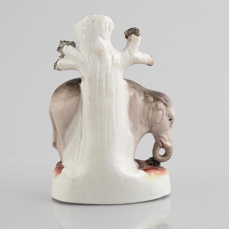 An elephant spill vase, Staffordshire, England, 19th century.