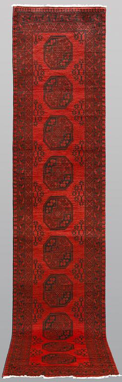 An Afghan runner, ca 390 x 79 cm.