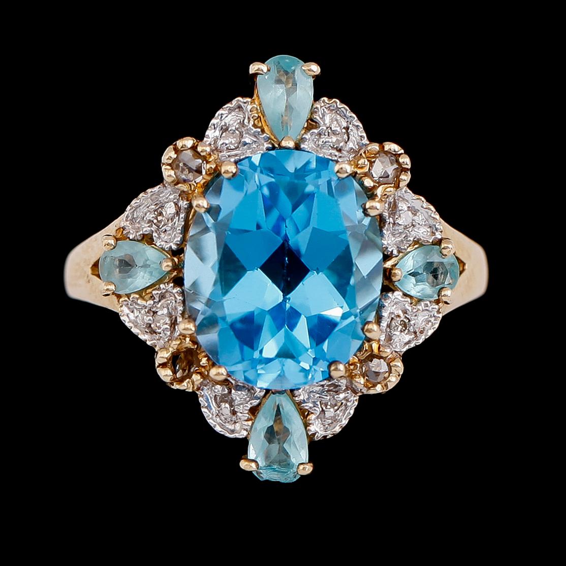 RING, 10 k guld, stenar bl a blå topas ca 5.06 ct och diamanter 0.14 ct.