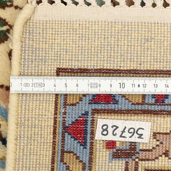 A carpet, signed, circa 286 x 212 cm.