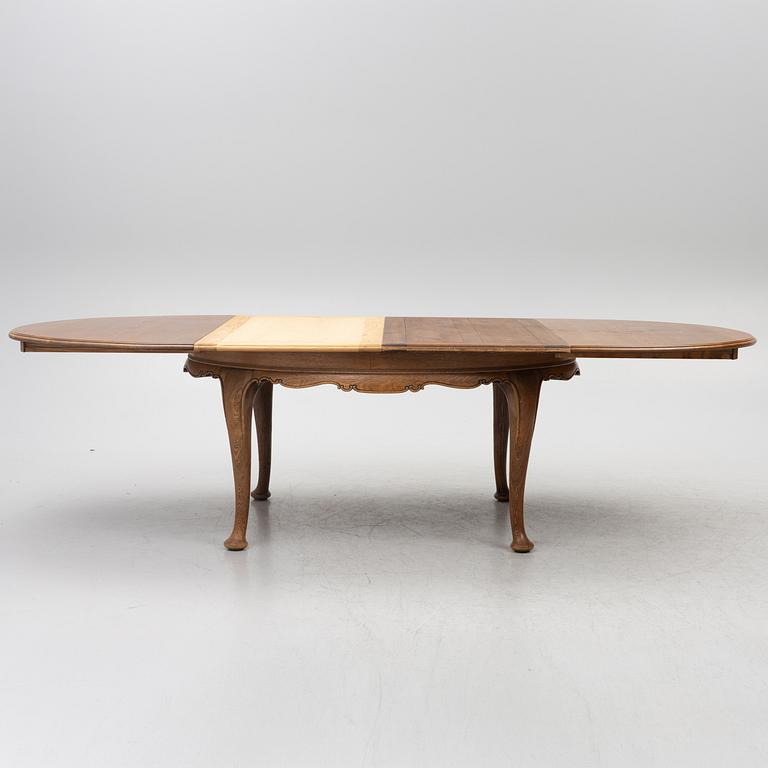 Dining table, 8 chairs, 2 armchairs, sideboard, Rococo style, early 20th century.