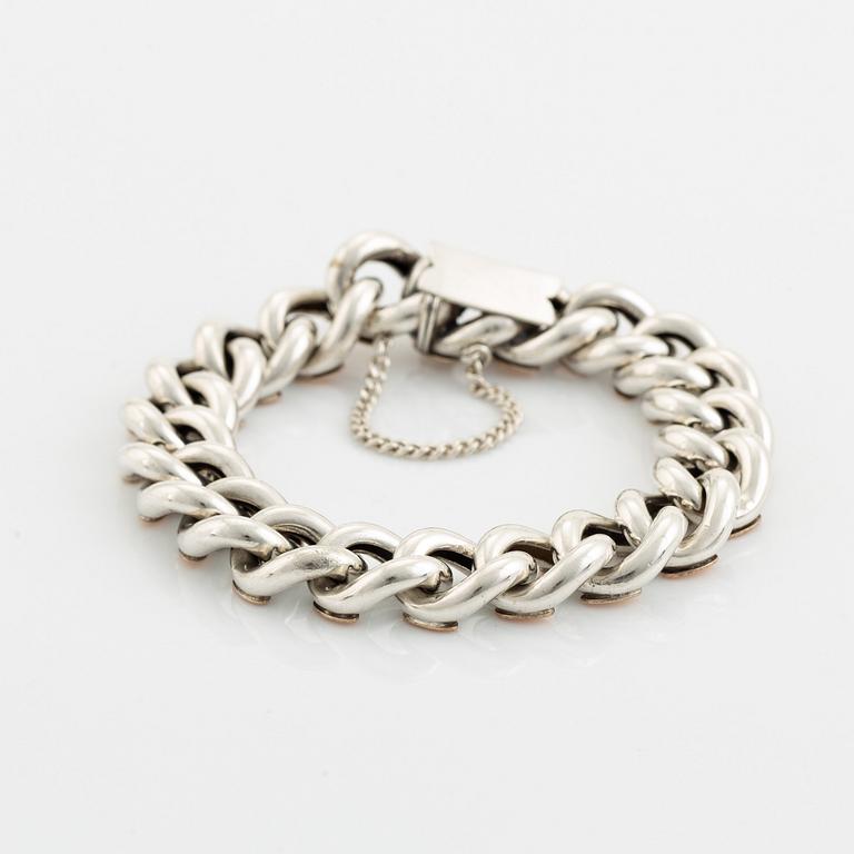 Silver bracelet.