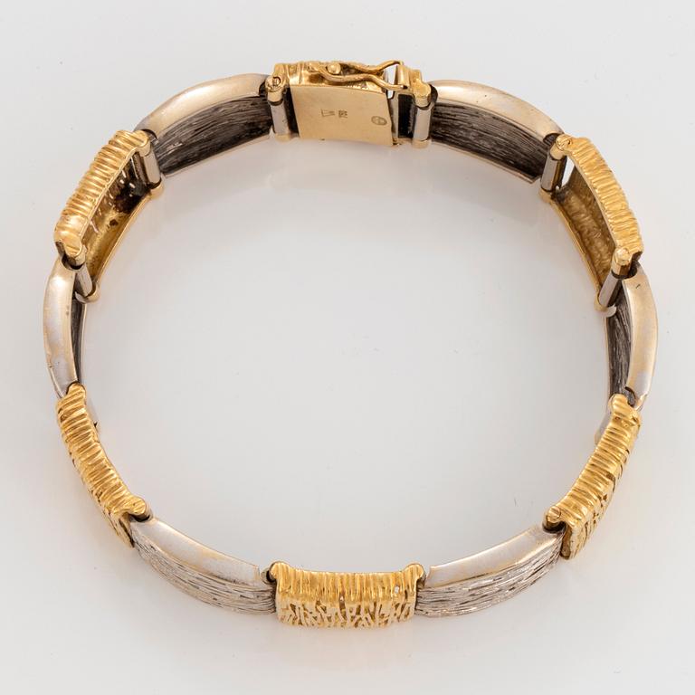 An 18K gold and white gold bracelet.