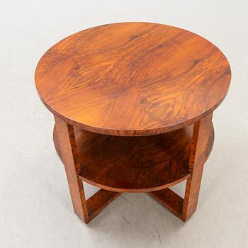 A mid 1900s walnut Art Deco table.