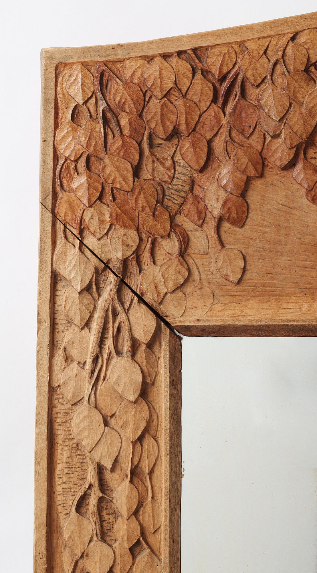 A Swedish Art Nouveau/ Folk art carved mirror, early 20th century.