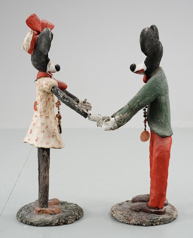 A pair of concrete sculptures of Mickey and Minnie Mouse, 20th century.