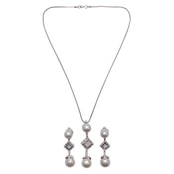 397. A SET OF JEWELLERY, pendant + earrings. 18K white gold. Diamonds of different shapes c. 3.00 ct. Weight 37,6 g.