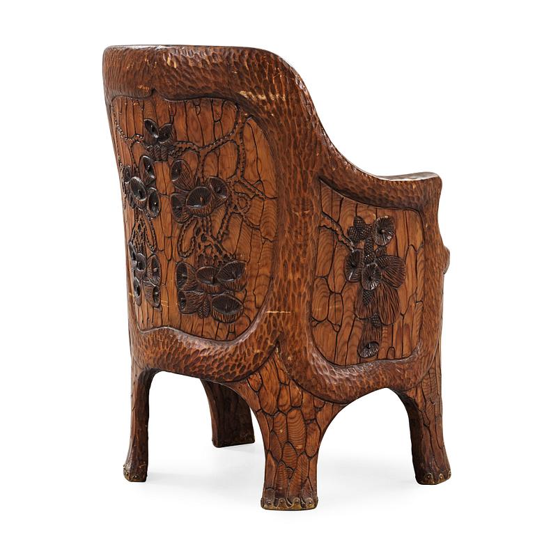 A Gustaf Fjaestad Art Nouveau carved pine chair, 'Stabbestol', by Adolf Swanson, Arvika, Sweden 1908.