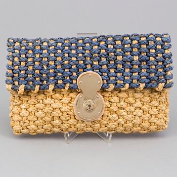 A  bast clutch by Ralph Lauren.