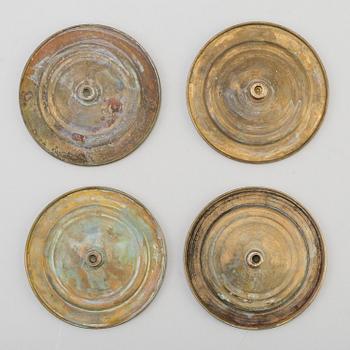 A SET OF FOUR BRONZE EMPIRE CURTAIN TIE-BACKS, first half of the 19th century.