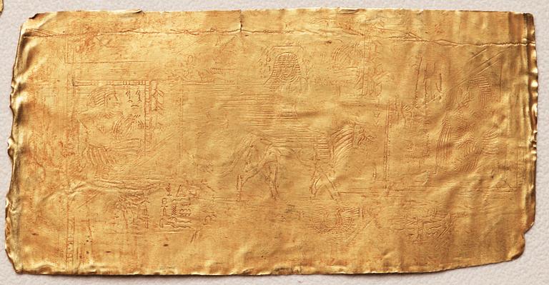 A set of nine presumably modern Egyptian-style gold foil sheets with figures and hieroglyphs.