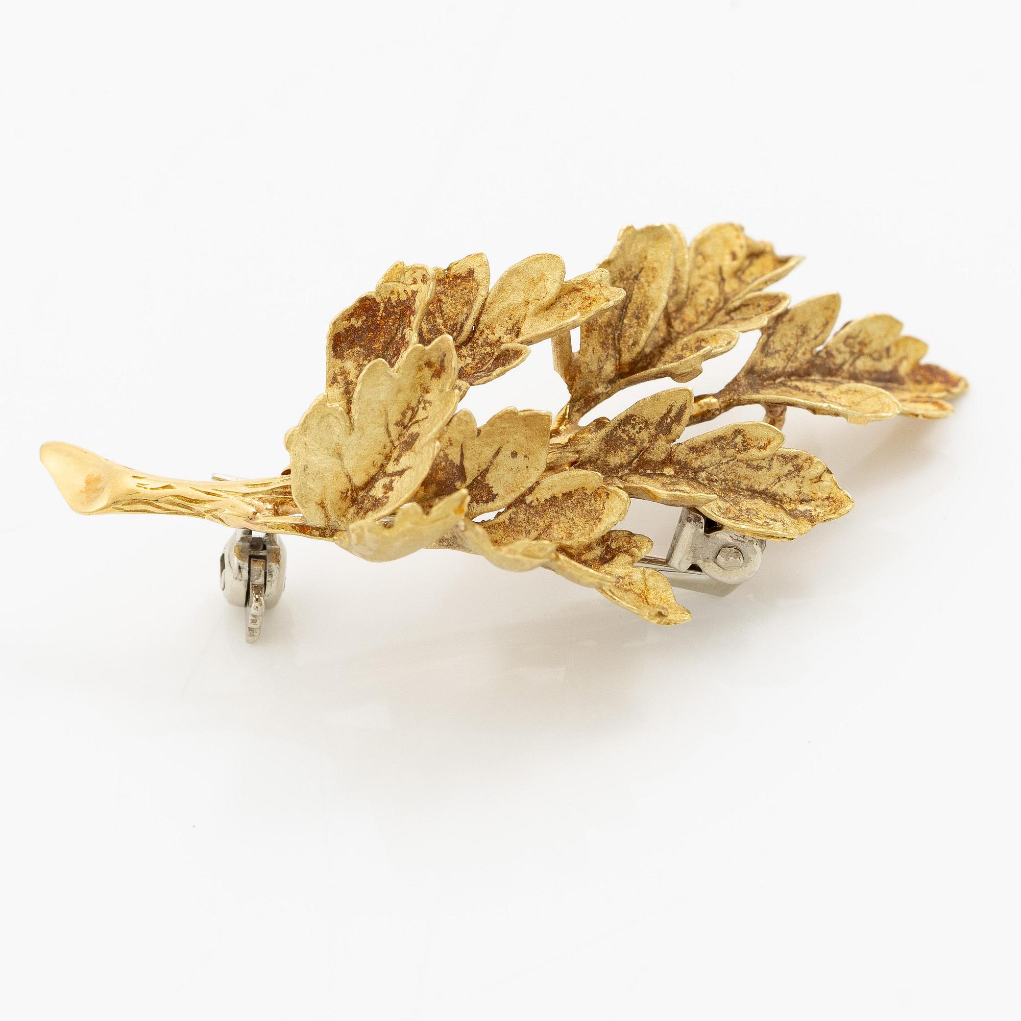 Brosch i form av ett löv 18K guld.