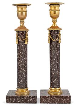 612. A pair of late Gustavian circa 1800 porphyry candlesticks.