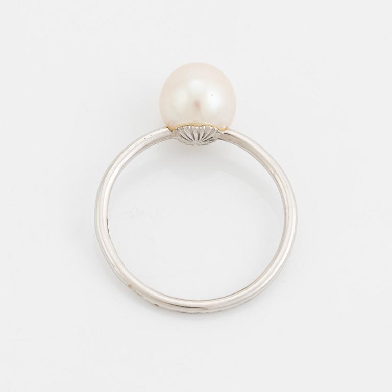 White gold earrings and ring with pearl and white stones.