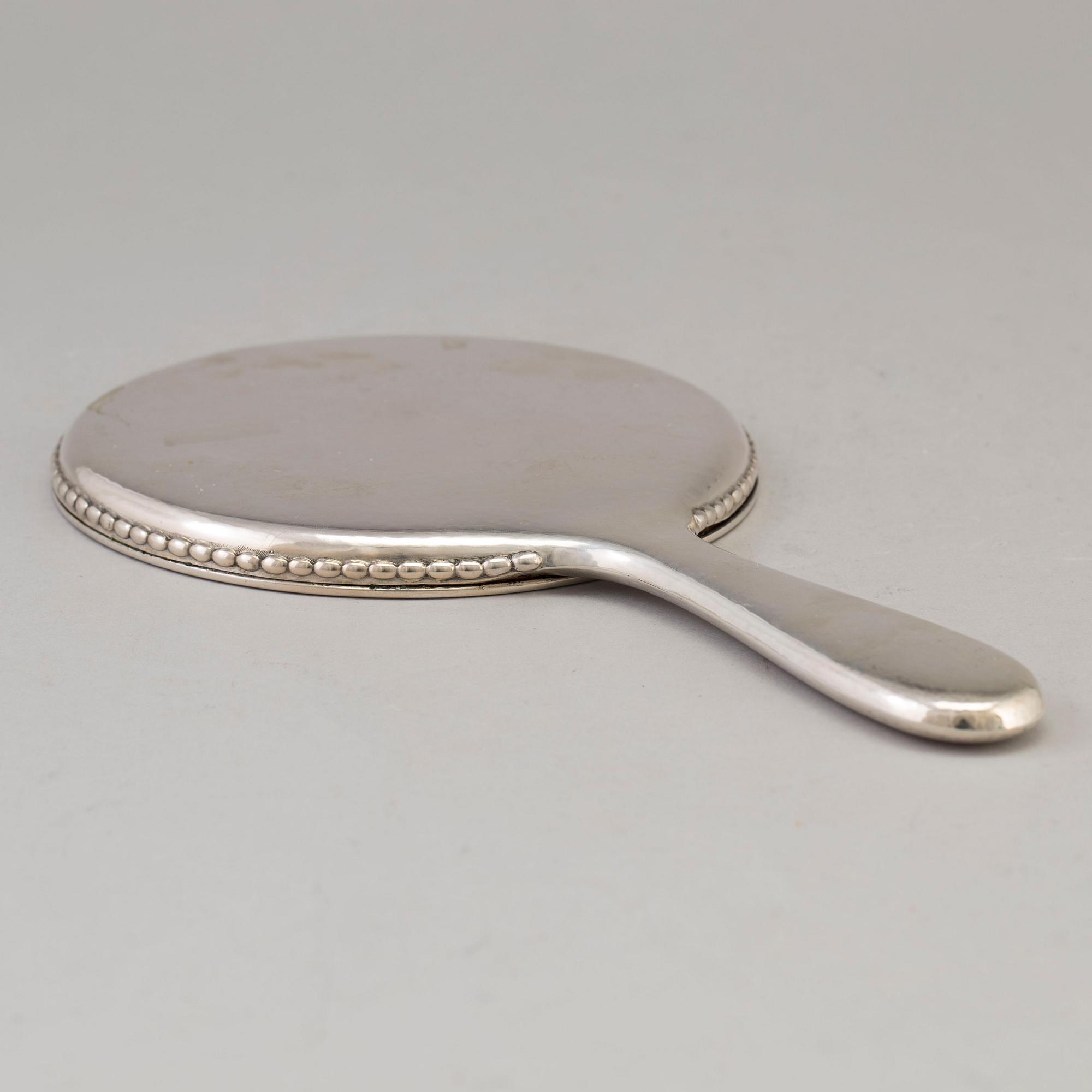 A Swedish silver hand mirror, maker's mark K. Anderson, Stockholm 1919.