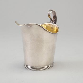 a 1824's silver creamer.