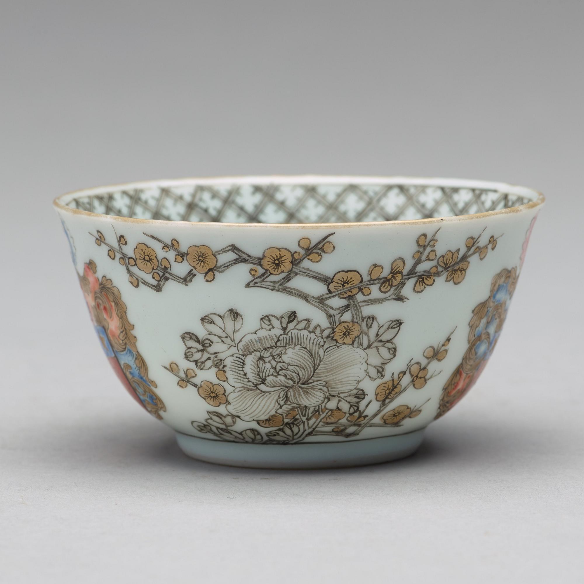 A famille rose armorial cup with saucer, Qing dynasty, 18th Century.