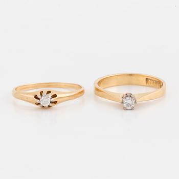 Two rings set with round, brilliant-cut diamonds, 18K gold and white gold.