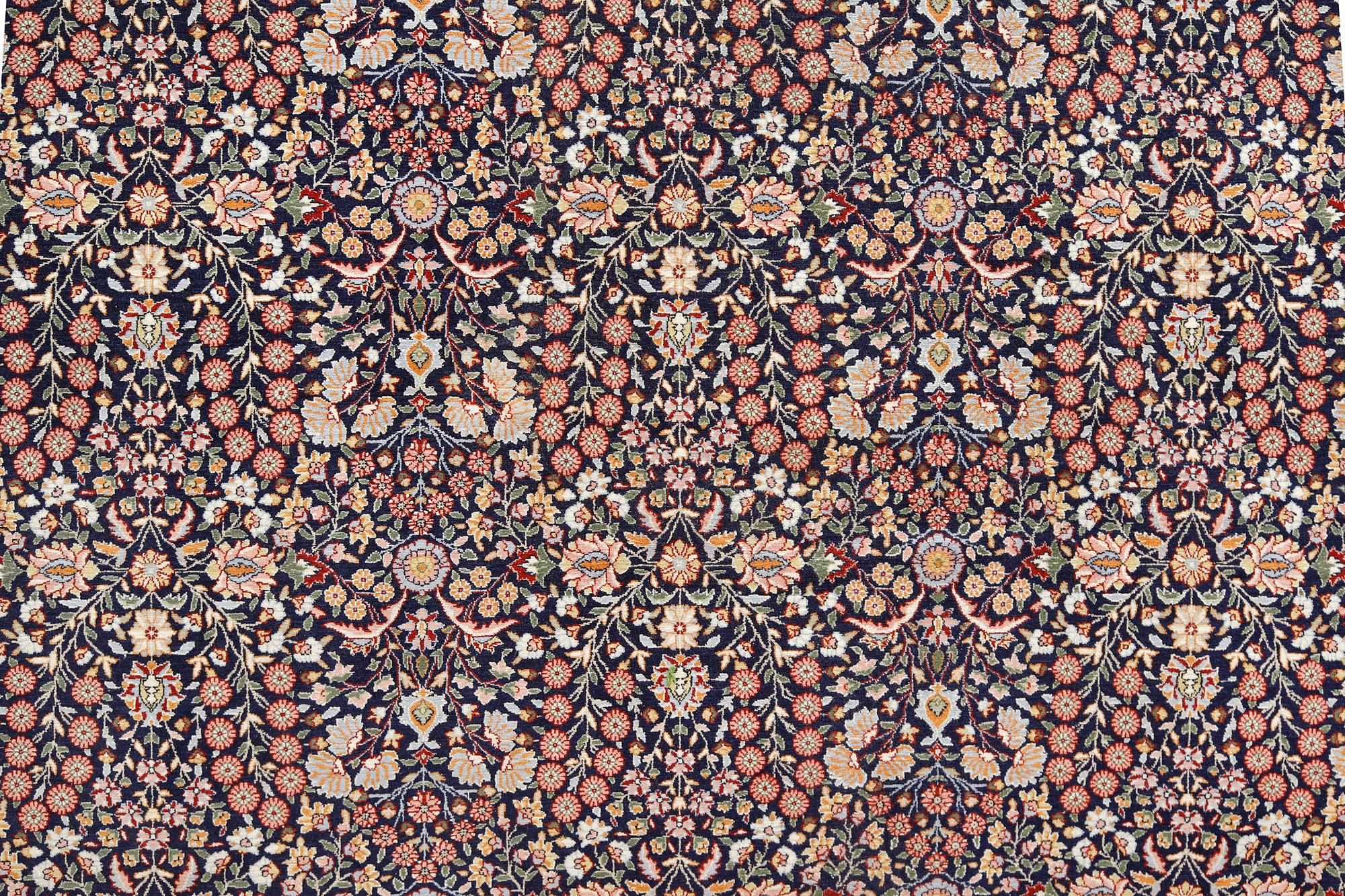 A signed Hereke carpet, ca 340 x 246 cm.