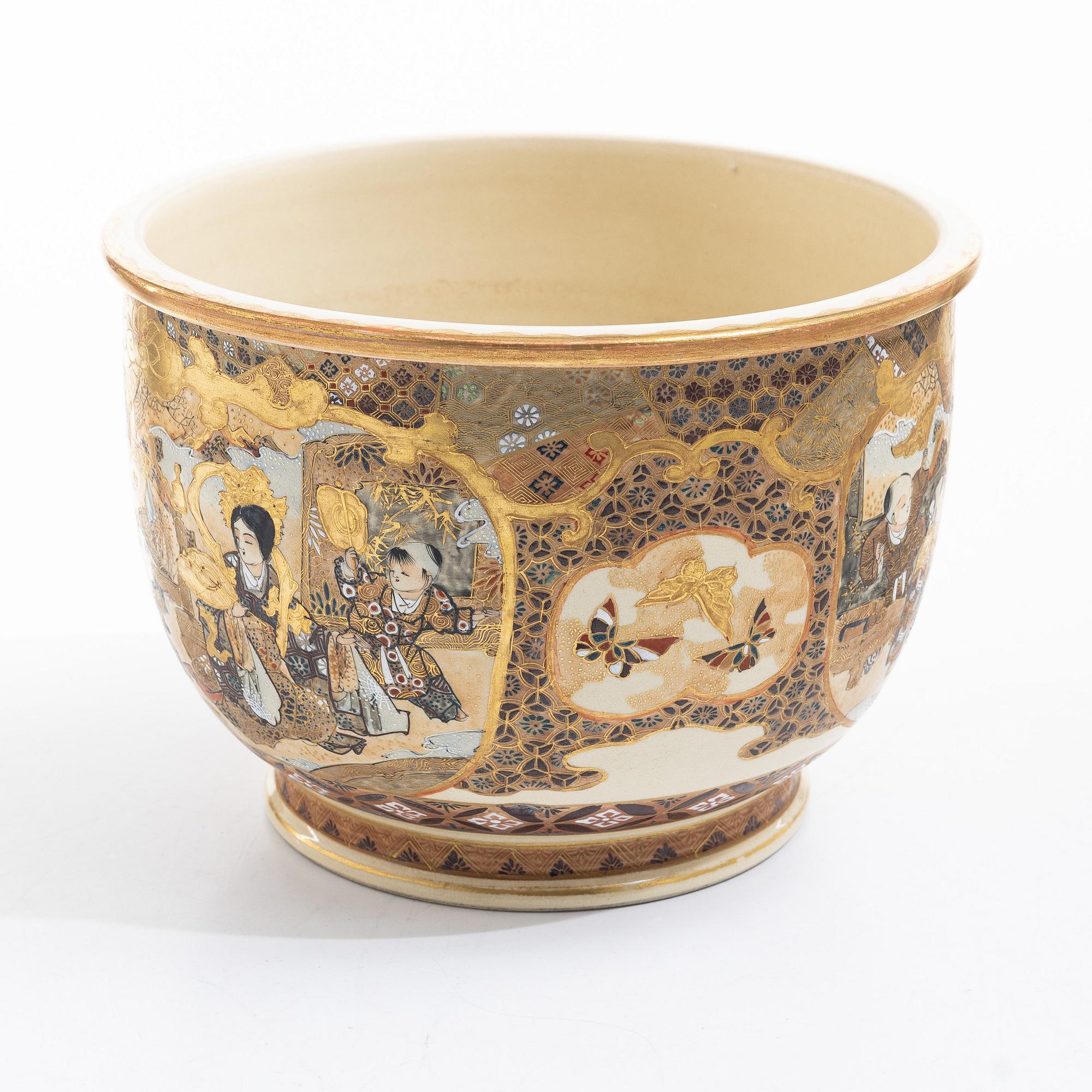 A Japanese satsuma figural flower pot, early 20th century.