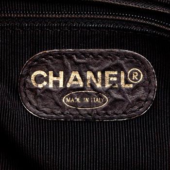 CHANEL, a quilted dark brown leather shoulder bag.