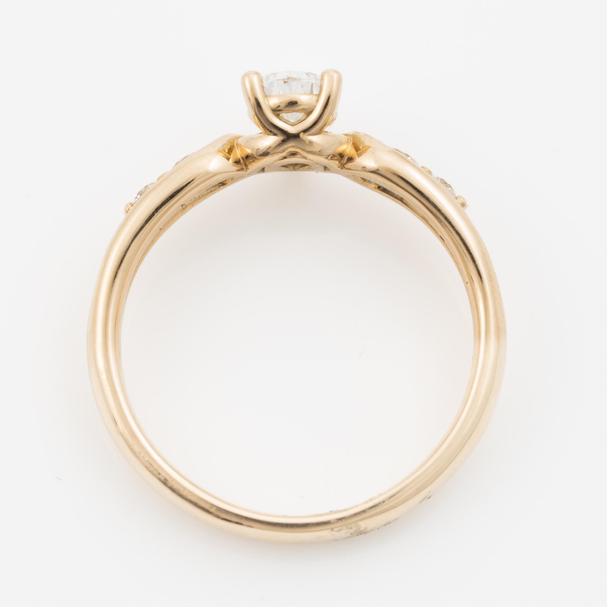 Ring 14K guld med droppslipad diamant, medföljande IGI report.