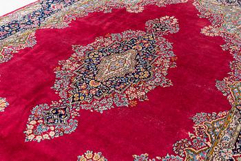 A Kirman carpet, signed, c. 388 x 279 cm.