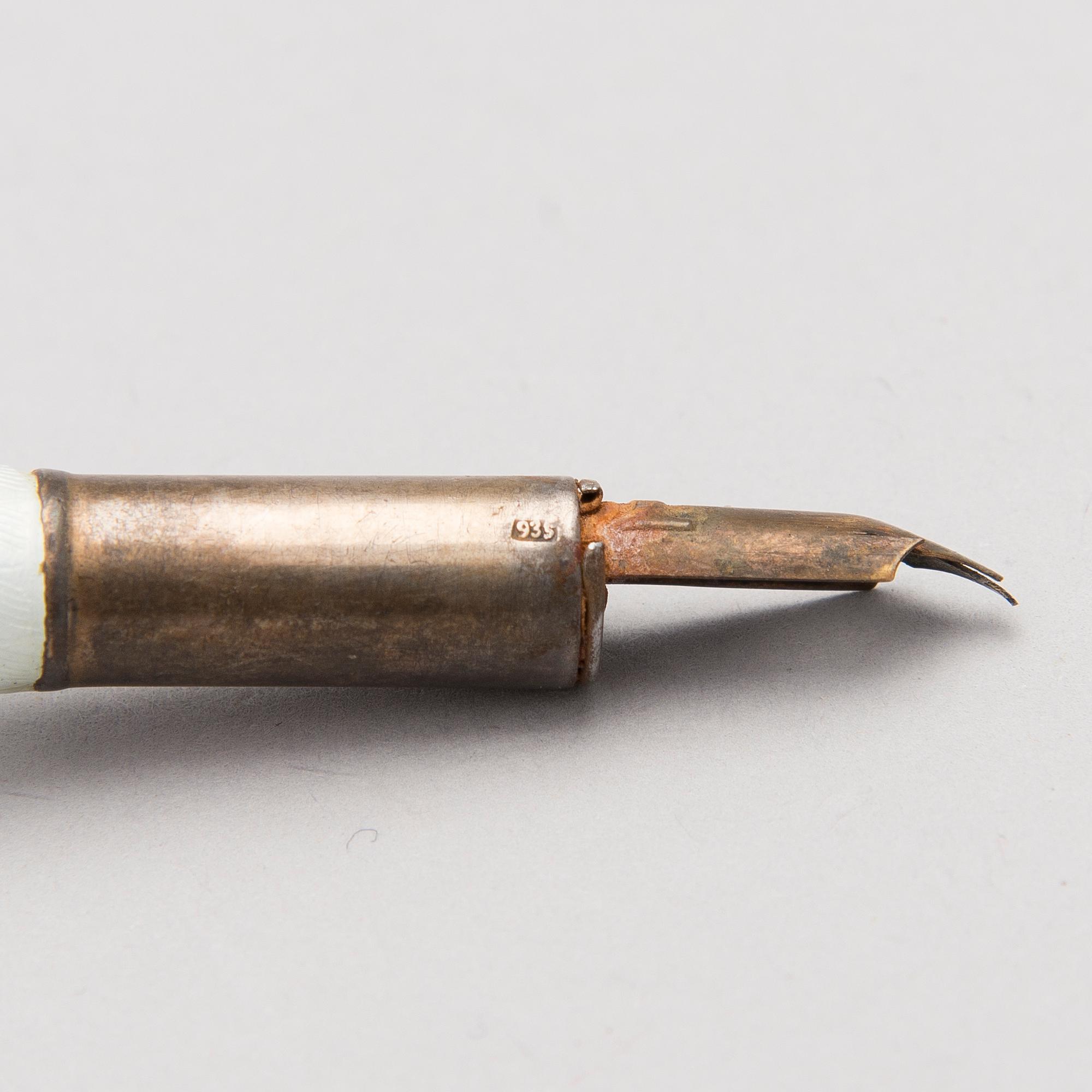 A silver case, Nikolai Kemper, and a pen and a paper knife in silver and enamel, import marks St Petersburg early 1900s.