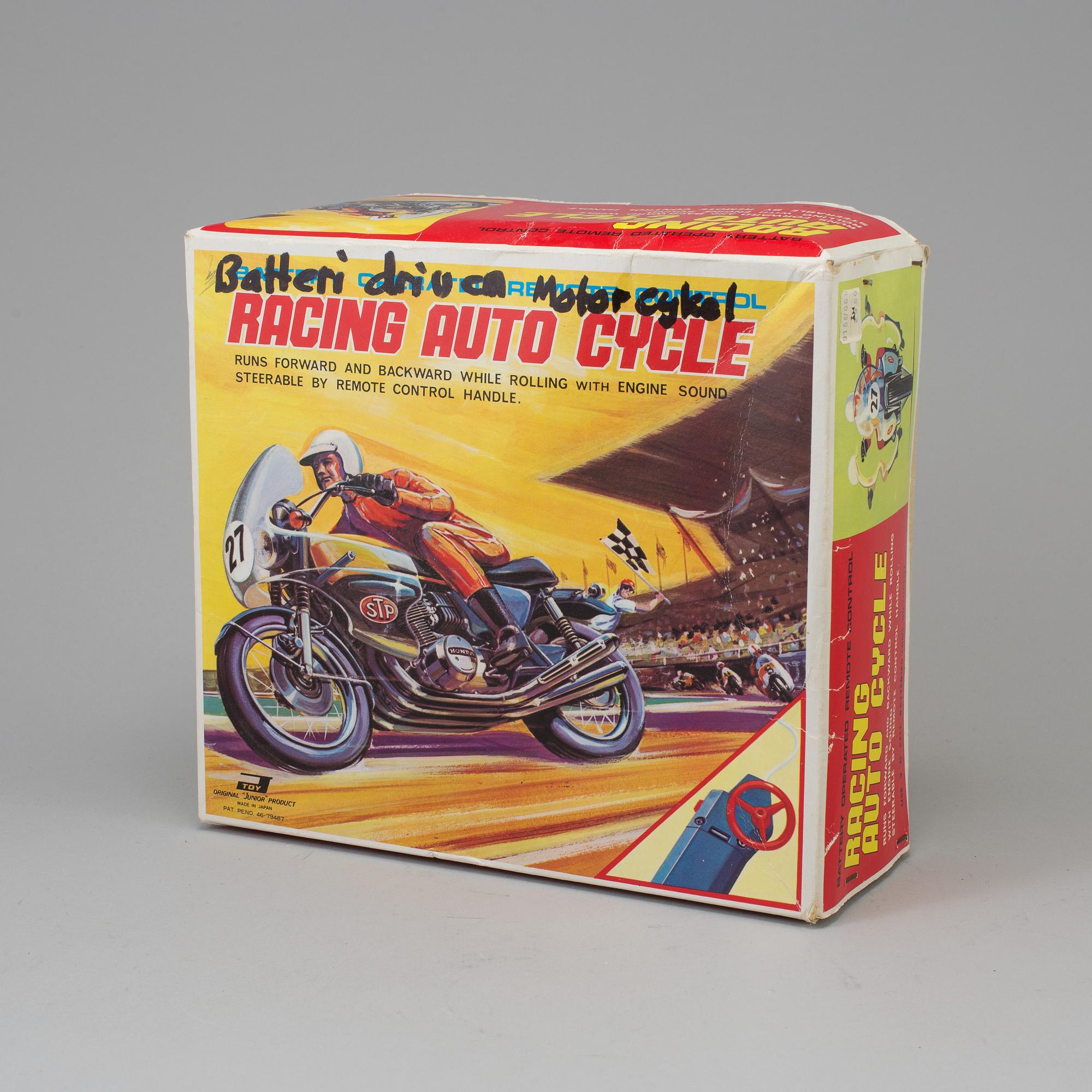 A 1970s battery operated toy racing auto cycle,Original "Junior" Product, Japan.