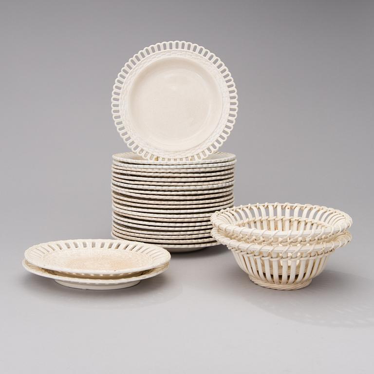 Twenty-five pieces of fayence tableware. Plates marked Rörstrand mid 19th century.