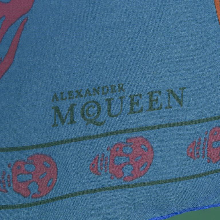 A scarf by ALEXANDER McQUEEN.