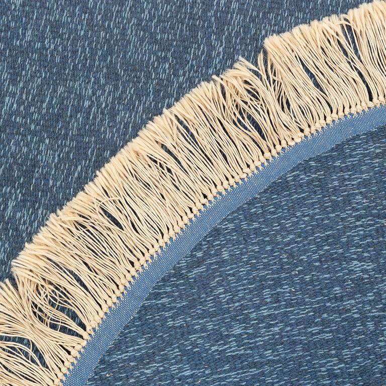 A rug, diameter circa 188 cm.