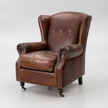 An armchair, contemporary.