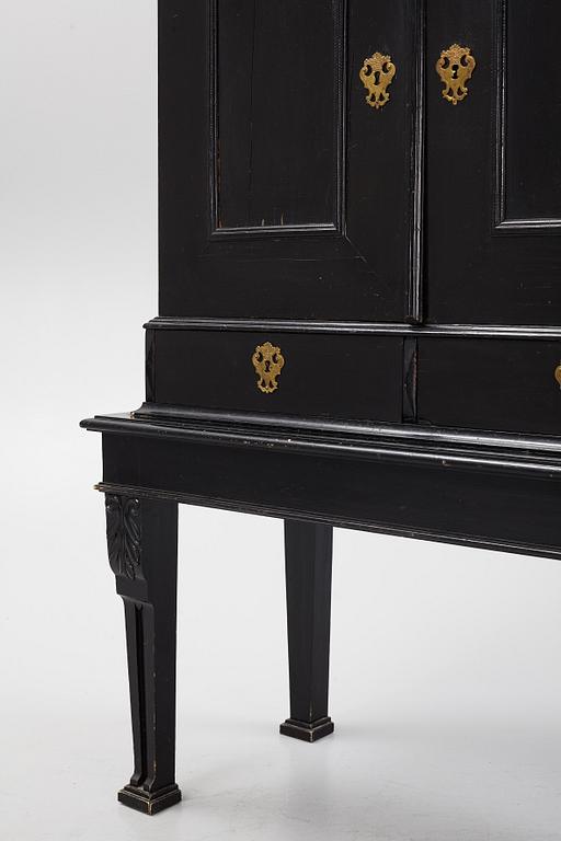 A South-German Baroque ebonized collector's cabinet on stand, circa 1700.