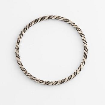 A Georg Jensen bangle in sterling silver.
