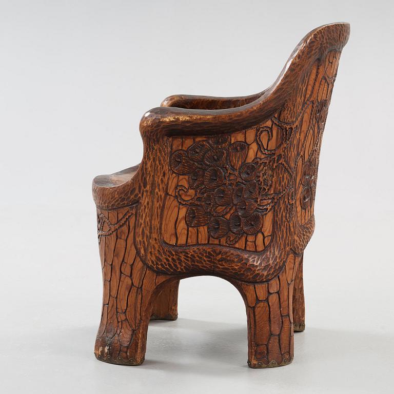 A Gustaf Fjaestad Art Nouveau carved pine chair 'Stabbestol', by Adolf Swanson, Arvika, Sweden 1908.