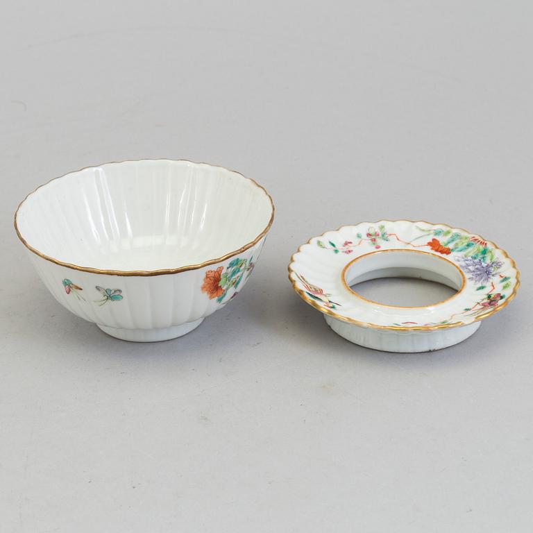 A Chinese famille rose porcelain cup with stand, Qing dynasty, Tongzhi (1862-1874), with Tongzhis mark to the base.