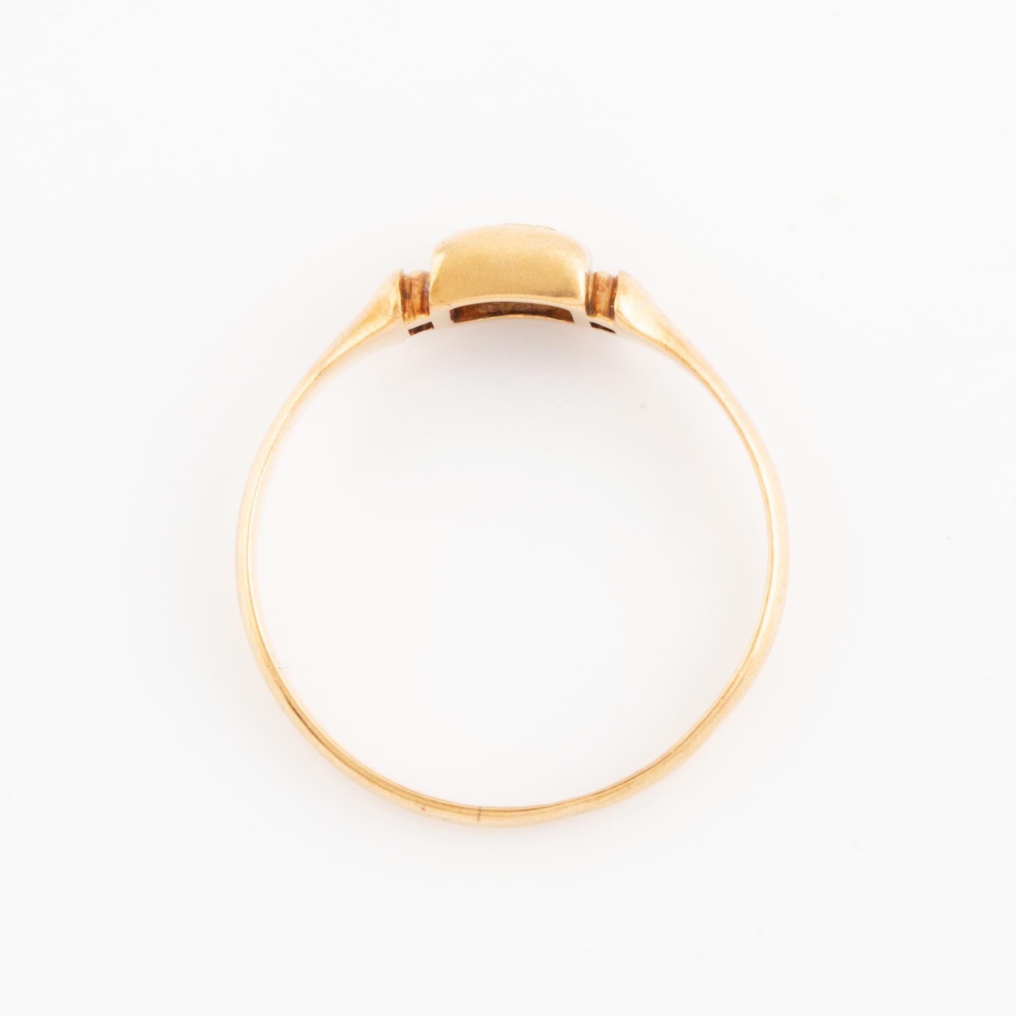 Faceted white stone ring.