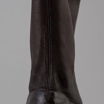 Brown leather boots by Chanel.