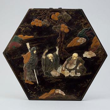 A lacquered panel with stone and mother of pearl inlay, China, circa 1900.