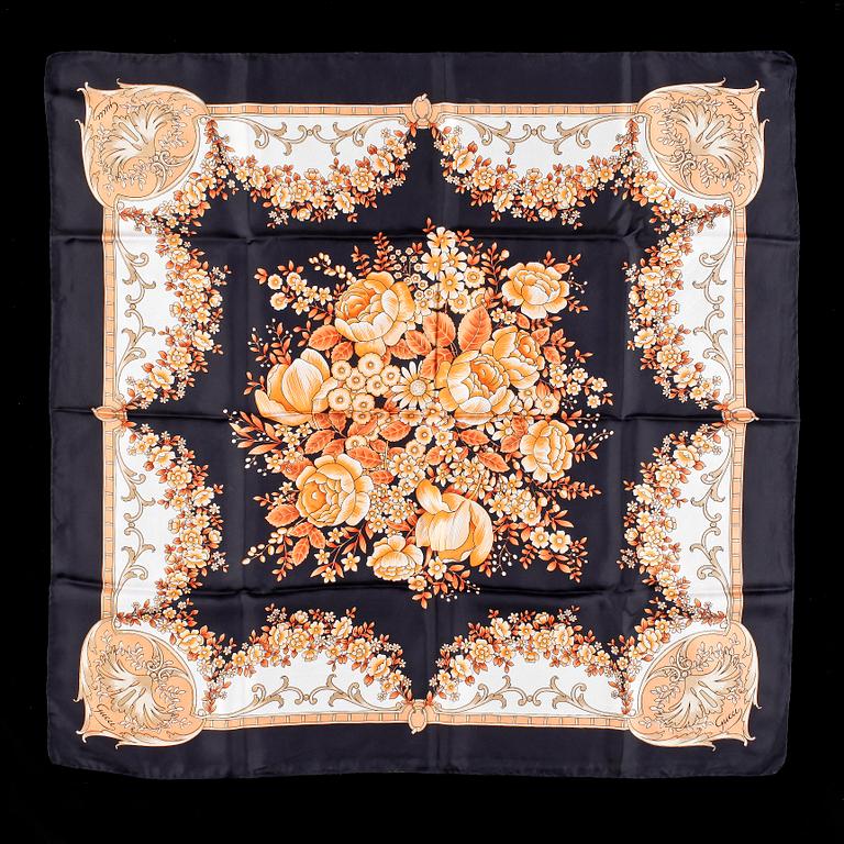 Two silk scarves by Chanel and Gucci.